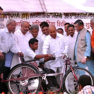 Gehlot distributing the assistive devices to disabled person