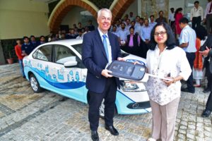 Dr. Andreas Lauermann, President & MD, Volkswagen India handing over the car keys to Dr. Swati Majumdar Pro-Chancellor, SSOU