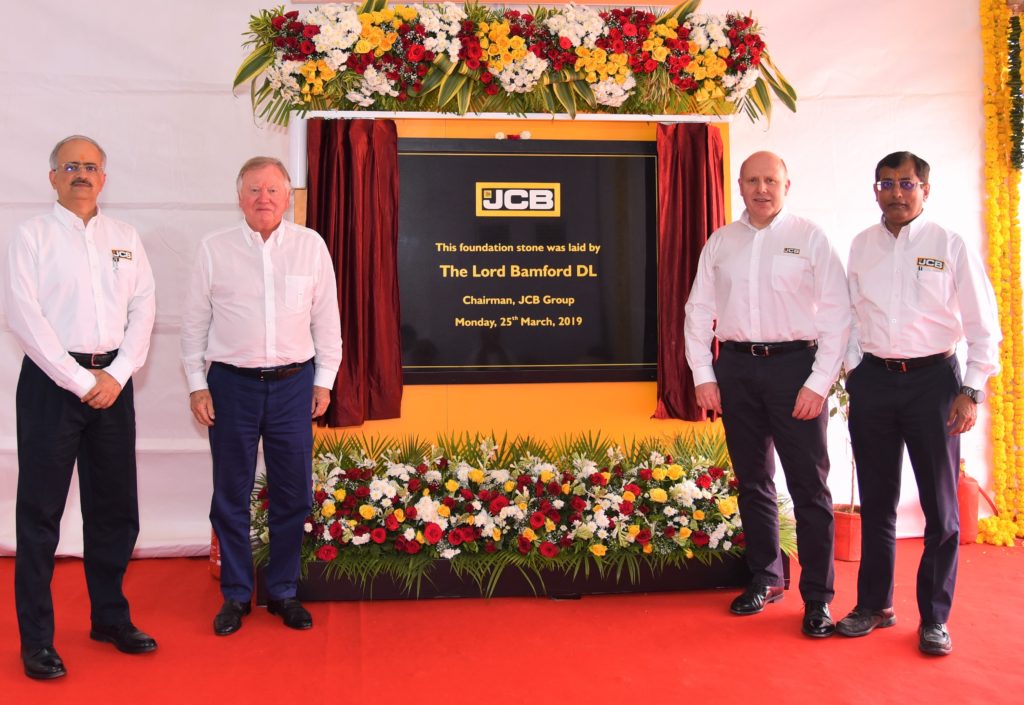 From Left to Right Mr. Vipin Sondhi, MD & CEO, JCB India_ Mr. Lord Bamford, Chairman JCB Group_ Mr. Mark Turner, COO, JCB Group & Mr. Subir Chowdhury, COO JCB India