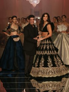 Designer Manish Malhotra poses with showstopper Katrina Kaif at the opening show of Lakme Fashion Week with Love & Care_1