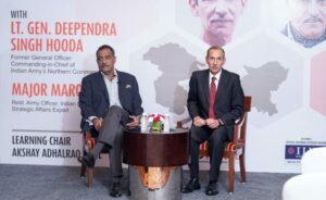 (L-R) Major Maroof Raza and Lt. Gen. Deependra Singh Hooda speaking at the event-'A Conversation on Article 370' at Hotel JW Marriot