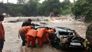 NDRF officials checking a vehicle.