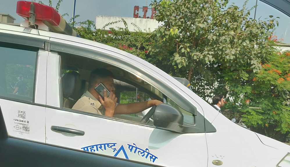 Pune police fine control room driver for speaking on phone.