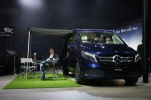 Photo 1 - Martin Schwenk, Managing Director & CEO, Mercedes-Benz India posing with the V-Class Marco Polo launched at the Auto Expo in Delhi