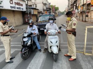 Pune police check people during lockdown.