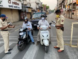 Pune police check people during lockdown.