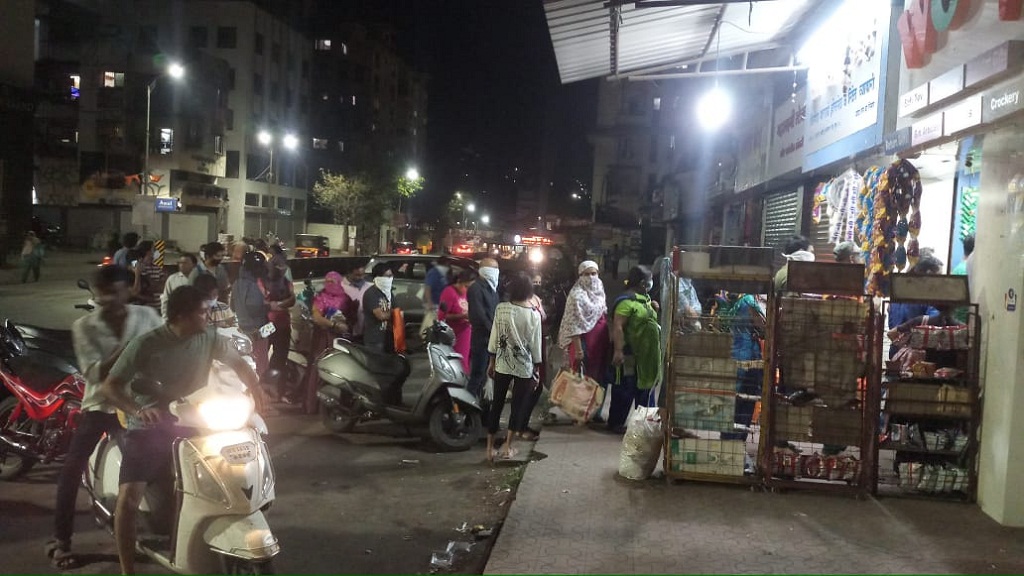 People crowd kirana shop