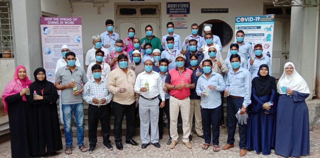 Poona College Staff with Mask and Sanitizer