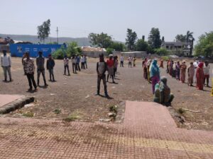 Bhor villagers wait their turn to get ration from Sadhu Vaswani Mission