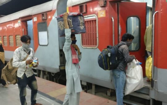 People boarding train at Pune railway station for Gorakhpur.