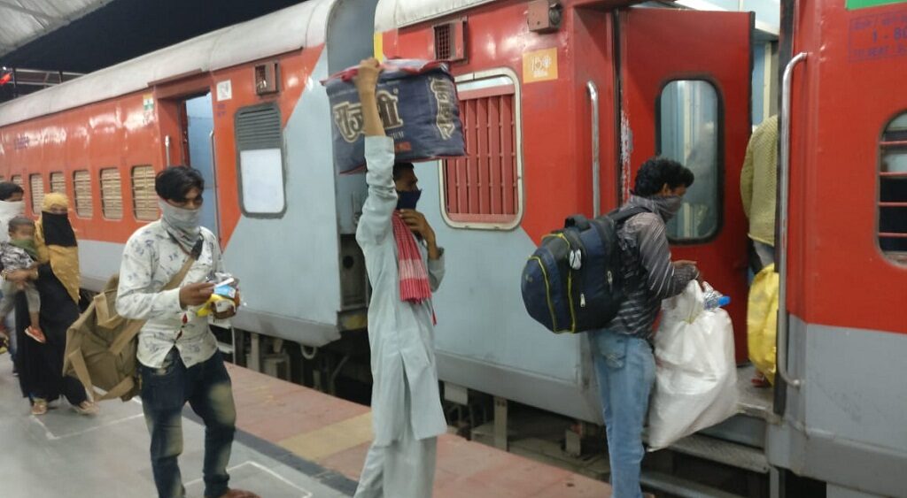 People boarding train at Pune railway station for Gorakhpur.