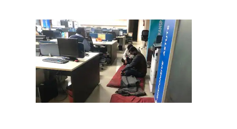 customer sits in bank branch after deduction from account