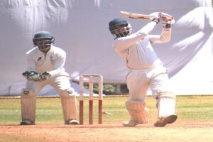 Shaunak Tripathi of Vision Cricket Academy playing attacking shot against Varroc Bowler at Vision Sports Ground