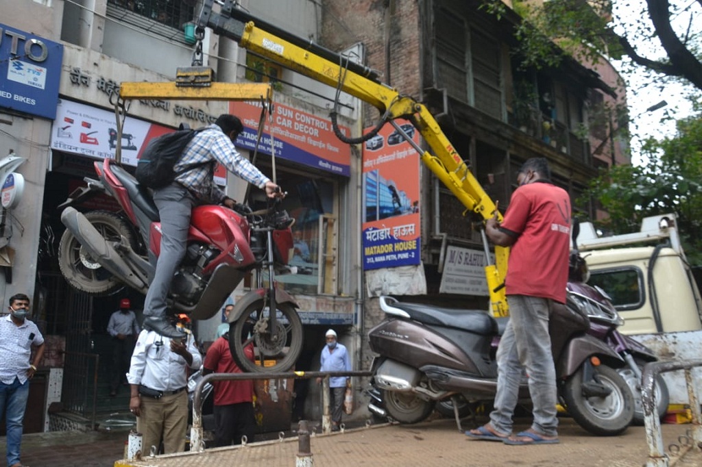 Pune man towed with bike