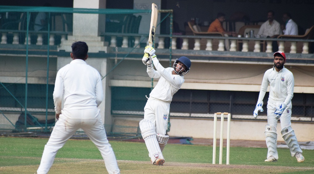 Prathamesh Bajari of MCA West Zone playing attacking shot against MCA Central Zone bowler at PYC Ground.