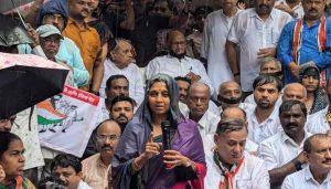 Opponents protest in heavy rain against women oppression