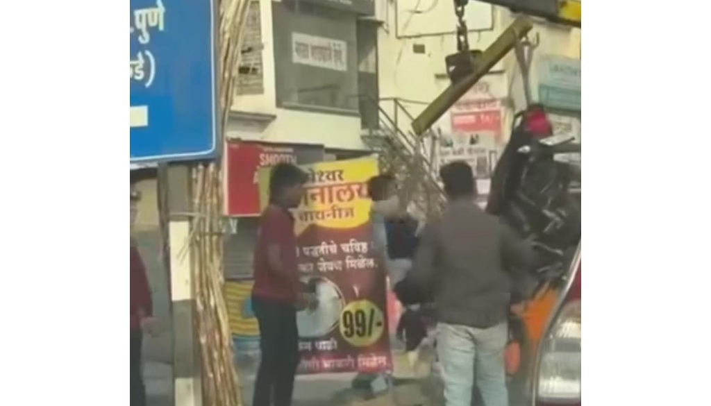 Man Hangs On Crane To Rescue Towed Vehicle