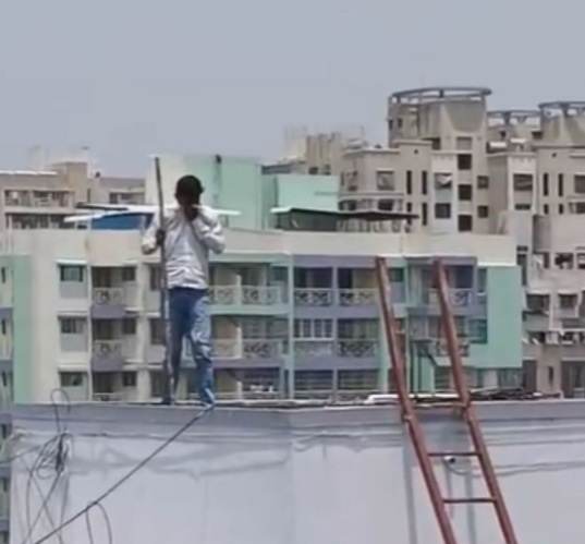 Man Armed with Iron Rod Climbs Water Tank in Kondhwa