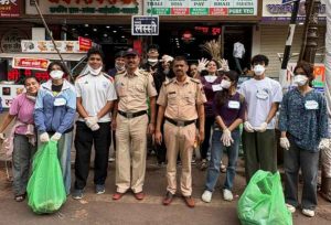 Youth Volunteers Clean Streets Outside Dagdusheth Temple