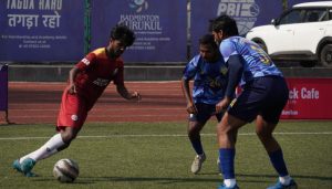 Action photo New India Soccer Club(Orange Shirt) and Real Pune United(Sky Blue Shirt).