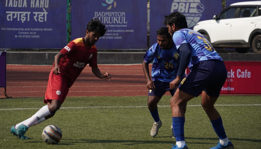 Action photo New India Soccer Club(Orange Shirt) and Real Pune United(Sky Blue Shirt).