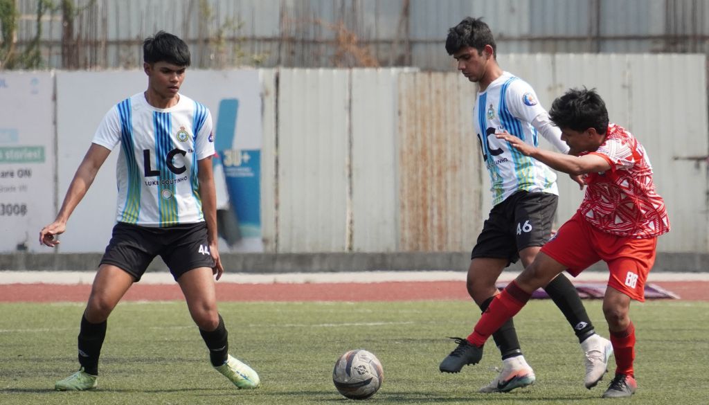 Action photo of match between Diego Junior FC(White & Sky Blue Shirt) and Thundercatz FC(Orange Shirt)