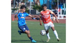 Action photo of GOG FC(Orange Shirt) and New Indian Soccer Club