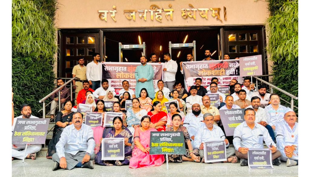 Wearing Helmets and Black Bands, MVA Corporators Protest