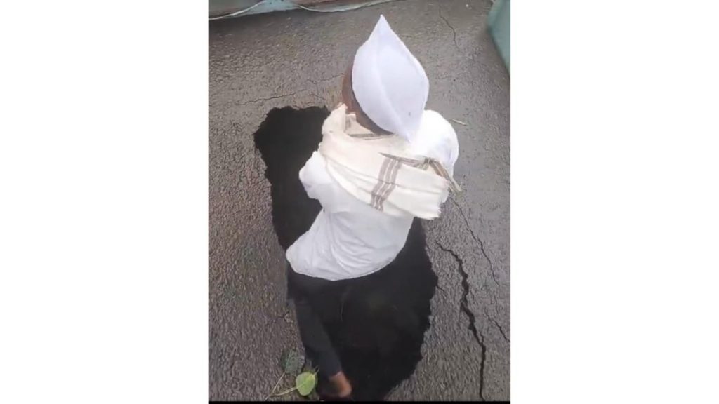 Senior Citizen Climbs Into 3-Foot-Deep Pothole to Protest Dangerous Road in Upper Indiranagar
