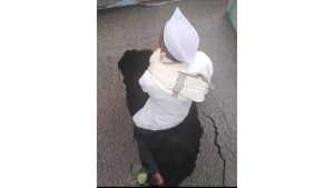 Senior Citizen Climbs Into 3-Foot-Deep Pothole to Protest Dangerous Road in Upper Indiranagar
