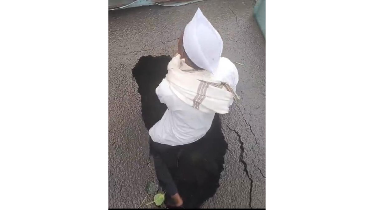 Senior Citizen Climbs Into 3-Foot-Deep Pothole to Protest Dangerous Road in Upper Indiranagar