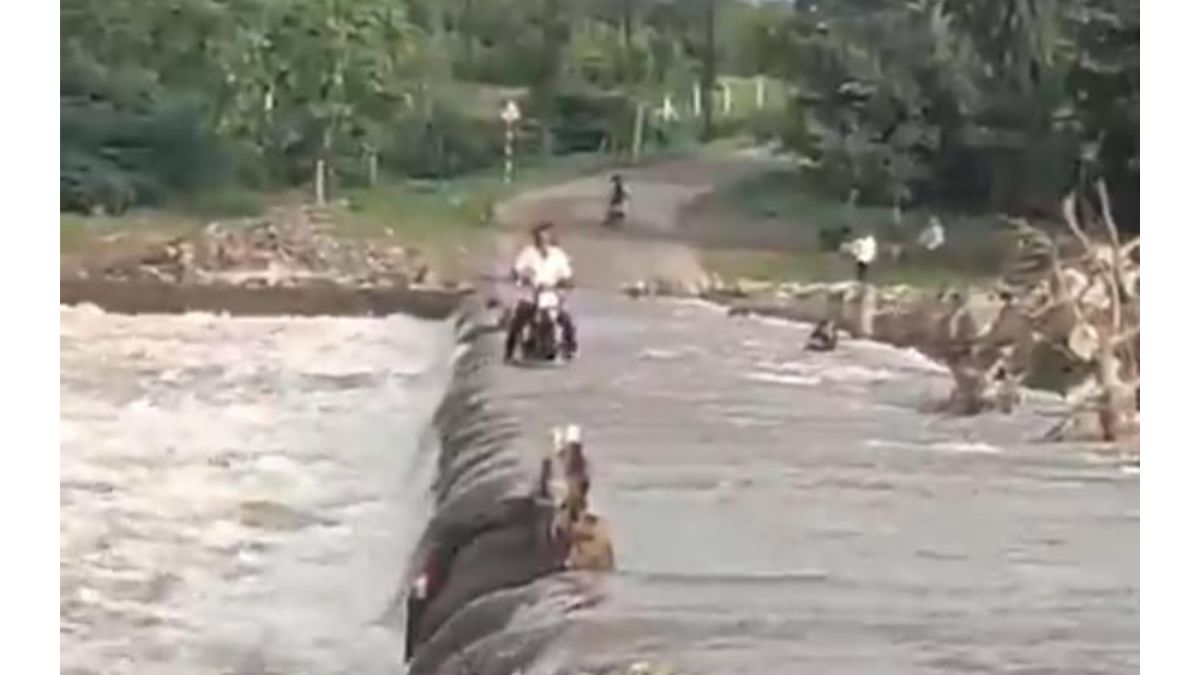 Senior Citizen Swept Away While Crossing Flooded Weir on Motorcycle Near Uruli Kanchan