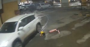 girl under car